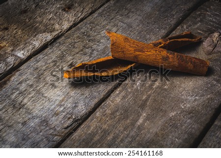 Cinnamon spices for prepare tasty food with soft shadow in the wooden background