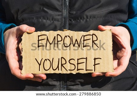Girl holding a carton paper with text Empower yourself