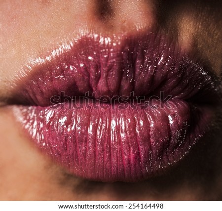 kiss lips with pink shiny lipstick