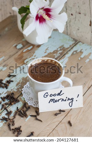 Pictures of sunny summer morning with beautiful flower, delicious turkish coffee on a rusted old table with decorations.