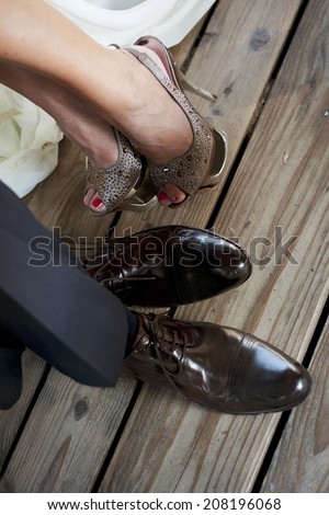 Wedding details. Bride and groom shoes.