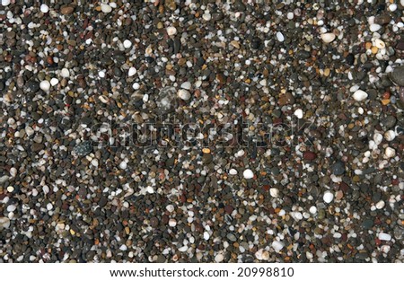 Pebble washed streaming sea water, and forming background