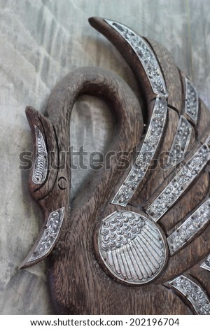 Swan Silver with carved wood trim.