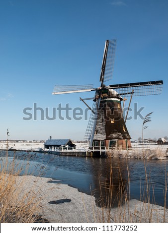 Windmill in winter setting, the location is Ottoland, Netherlands