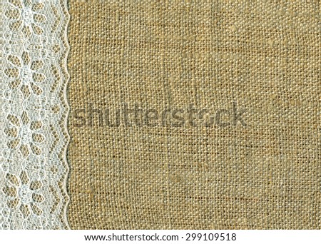 lace-ribbon-on-natural-linen-bright-cloth-fabric-background-border-frame