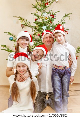 Portrait of friendly family on Christmas evening