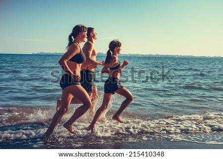 fitness family running in sea