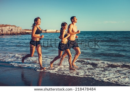 fitness family running in sea