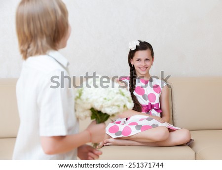 boy giving flowers to girl in Valentine's day