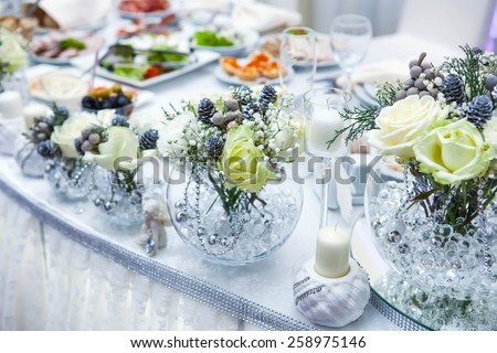 Table decor with flowers table numbers and candles