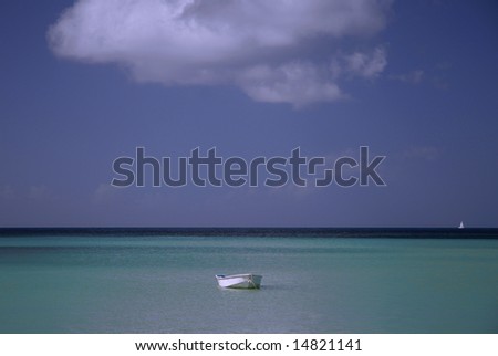 White boat in the ocean under the blue skies