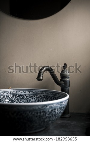 Antique Chinese style washroom with blue-and-white porcelain sink