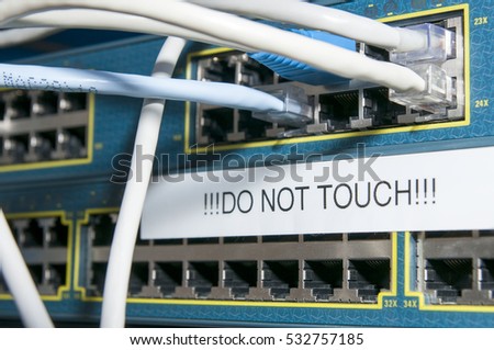 Router with plugged in cables and a sign of 