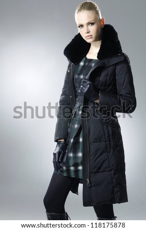fashion model in autumn/winter clothes posing