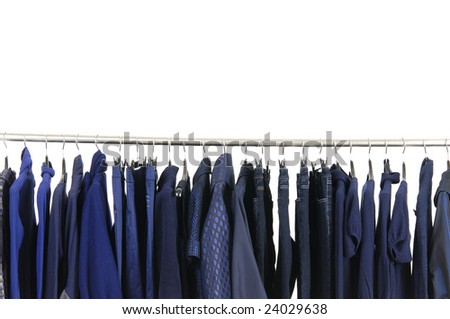A row of designer fashion clothing hanging on hangers