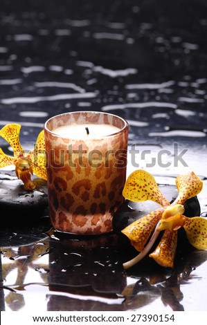 Spa still life with candle perfect flames and black stone