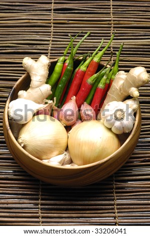 Fresh vegetables on bamboo containers over mat