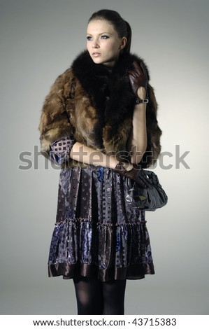 Fashion model holding little purse