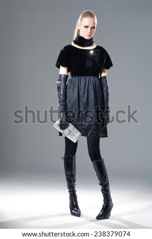 full-length High fashion model holding little purse posing