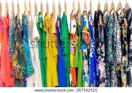 Set of fashion female colorful clothing hanging a on display