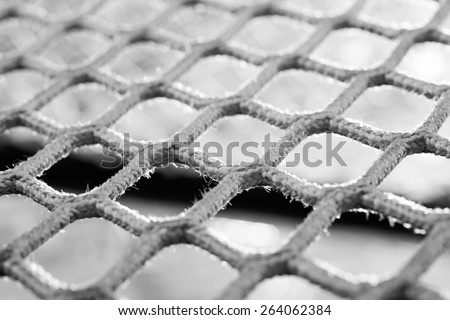Black and white macro of a hockey net - Shallow depth of field