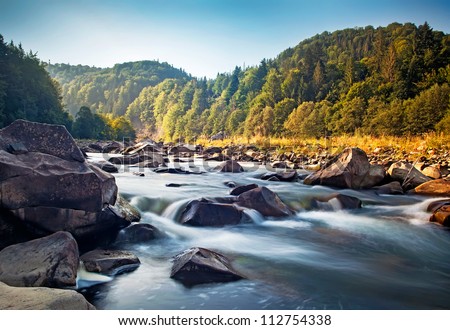 Mountain river with nature waterfall in forest