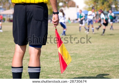 Girls\' football soccer referee watching over a game