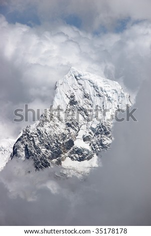 Cloud formations over snow summit, Himalaya