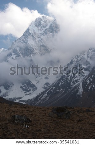 Snow summit in clouds, Himalaya, Nepal