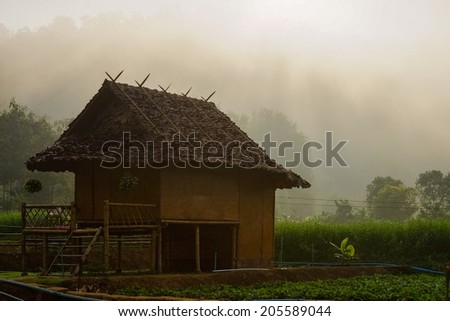 Rustic Farmhouse in the morning haze.