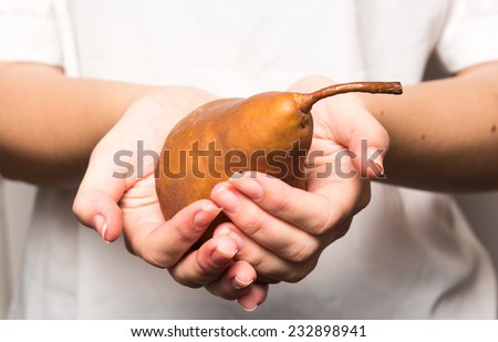pear with hands offering a pear