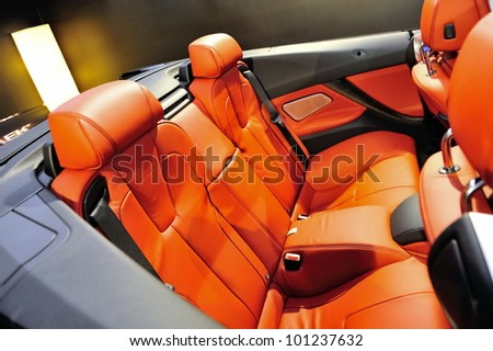 SINGAPORE - APRIL 28: Rear seats with orange leather upholstery in a BMW M6 Convertible at its Preview at Singapore Yacht Show April 28, 2012 in Singapore