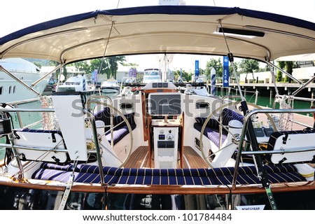SINGAPORE - APRIL 28: Interior of a luxury yacht with its steering and navigation system at Singapore Yacht Show April 28, 2012 in Singapore