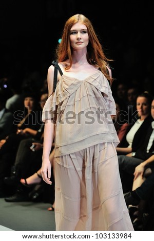 SINGAPORE - MAY 18: Model showcasing design by Saena from Berlin at Audi Fashion Festival 2012 on May 18, 2012 in Singapore