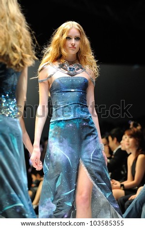 SINGAPORE - MAY 18: Model showcasing designs by Swarovski at Audi Fashion Festival 2012 on May 18, 2012 in Singapore