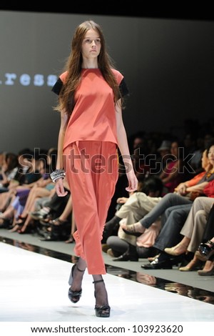 SINGAPORE - MAY 19: Model showcasing designs from Alldressedup at Audi Fashion Festival 2012 on May 19, 2012 in Singapore