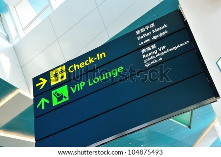 Check-in and VIP lounge signs in Marina Bay Cruise Center Singapore in 4 languages