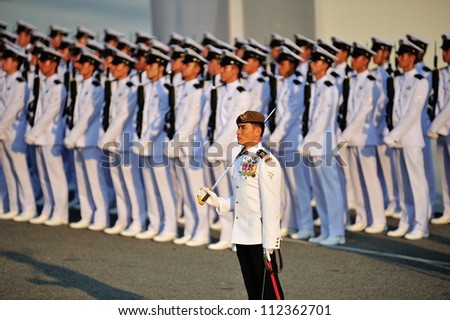 SINGAPORE - AUGUST 09: Parade Commander LTC Clarence Tan leading the parade ceremony during National Day Parade 2012 on August 09, 2012 in Singapore