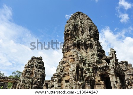 Four-sided face sculpture towers in ancient Bayon Temple in Angkor Thom city, Siem Reap in Cambodia