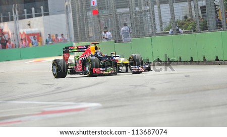 SINGAPORE - SEPTEMBER 22: Sebastian Vettel racing in his Red Bull Racing car during 2012 Formula 1 Singtel Singapore Grand Prix on September 22, 2012 in Singapore