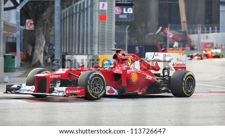 SINGAPORE - SEPTEMBER 22: Fernando Alonso cornering in his Ferrari car during 2012 Formula 1 Singtel Singapore Grand Prix on September 22, 2012 in Singapore