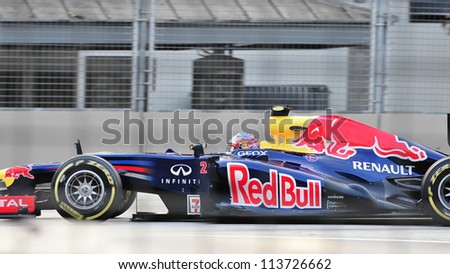 SINGAPORE - SEPTEMBER 22: Mark Webber racing in his Red Bull Racing car during 2012 Formula 1 Singtel Singapore Grand Prix on September 22, 2012 in Singapore