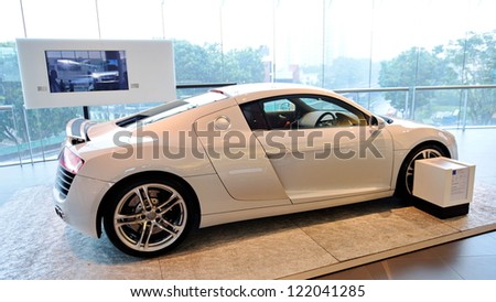 SINGAPORE - DECEMBER 15: Flagship white Audi R8 super car on display at the opening of the new Audi Centre Singapore December 15, 2012 in Singapore