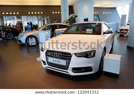 SINGAPORE - DECEMBER 15: White Audi S5 sports coupe on display at the opening of the new Audi Centre Singapore December 15, 2012 in Singapore