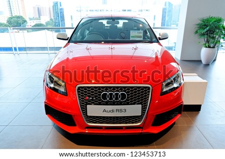 SINGAPORE - DECEMBER 15: Red Audi RS3 sports hatch on display at the opening of the new Audi Centre Singapore December 15, 2012 in Singapore