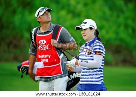 SINGAPORE - MARCH 2: Korean player Meena Lee walking from 1st tee box during HSBC Women\'s Champions at Sentosa Golf Club Serapong Course March 2, 2013 in Singapore