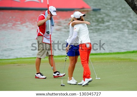SINGAPORE - MARCH 3: American Stacy Lewis hugging Na Yeon Choi as she won the HSBC Women\'s Champions at Sentosa Golf Club Serapong Course March 3, 2013 in Singapore