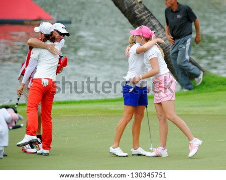 SINGAPORE - MARCH 3: American Stacy Lewis hugging Paula Creamer as she won the HSBC Women\'s Champions at Sentosa Golf Club Serapong Course March 3, 2013 in Singapore