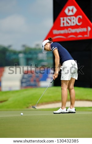SINGAPORE - MARCH 2: Korean Hee Kyung Seo putting at the green during HSBC Women\'s Champions at Sentosa Golf Club Serapong Course March 2, 2013 in Singapore