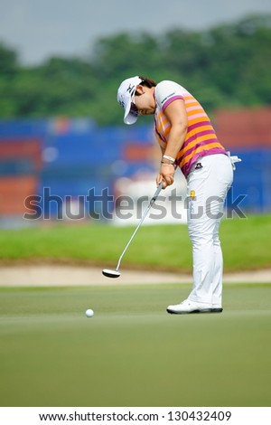 SINGAPORE - MARCH 2: Korean Jiyai Shin putting at the green during HSBC Women\'s Champions at Sentosa Golf Club Serapong Course March 2, 2013 in Singapore